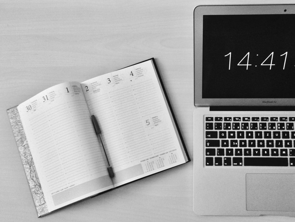 black and white diary with apple product